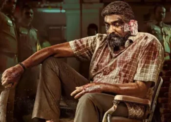 An injured man who is identified to be Vijay Sethupathi in the Tamil film Maharaja