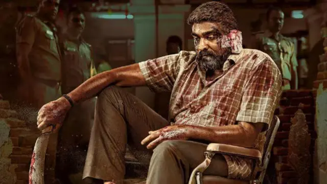 An injured man who is identified to be Vijay Sethupathi in the Tamil film Maharaja